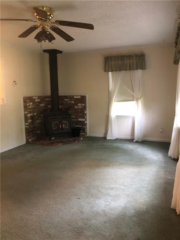 Living Room with wood-burning stove.