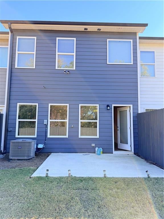 Rear view of property with a patio