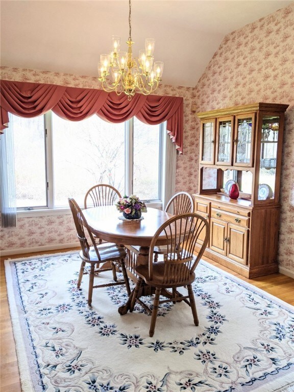 Dining room with view of private backyard and tree