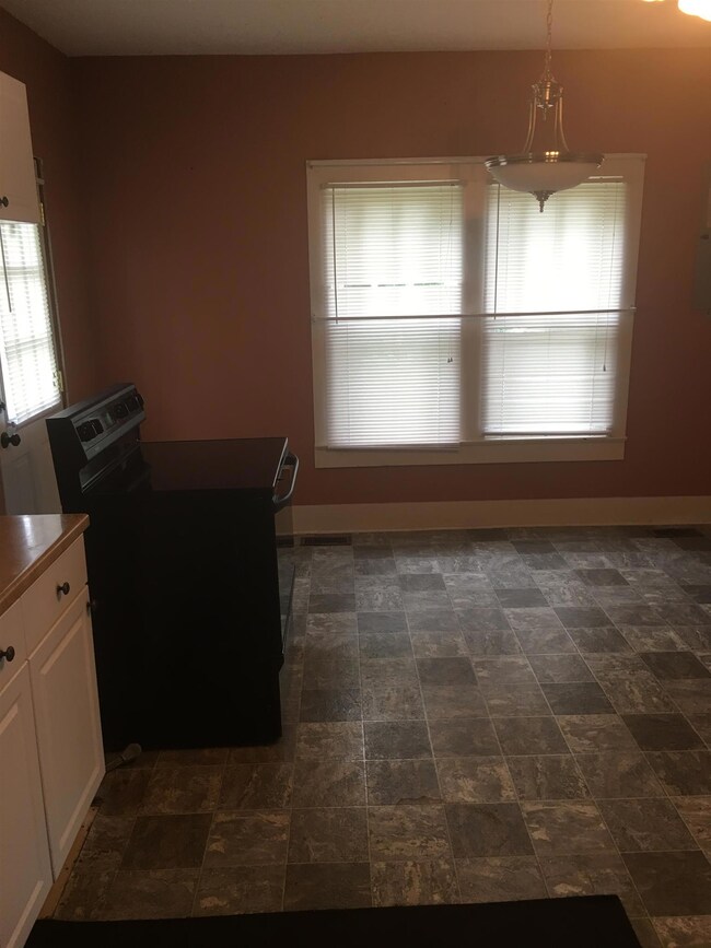 Kitchen has nice floors and plenty of natural light.  