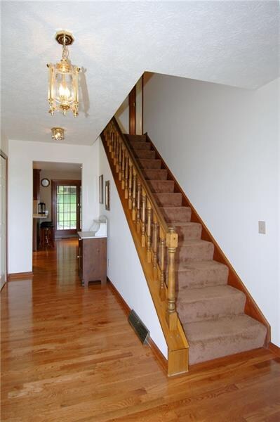 Beyond the front door with sidelights, the Foyer w