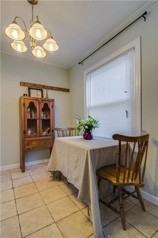 Kitchen includes a cute dining area and tile floor