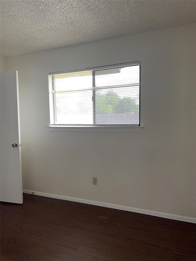 Empty room with baseboards, a wealth of natural l