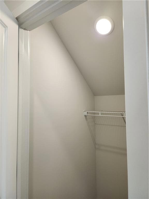 Spacious closet featuring lofted ceiling