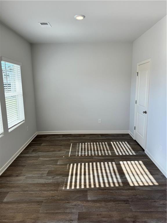 Unfurnished room featuring dark hardwood / wood-st