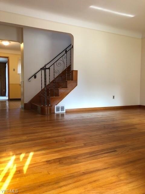 Living room into the kitchen.  Beautiful solid har