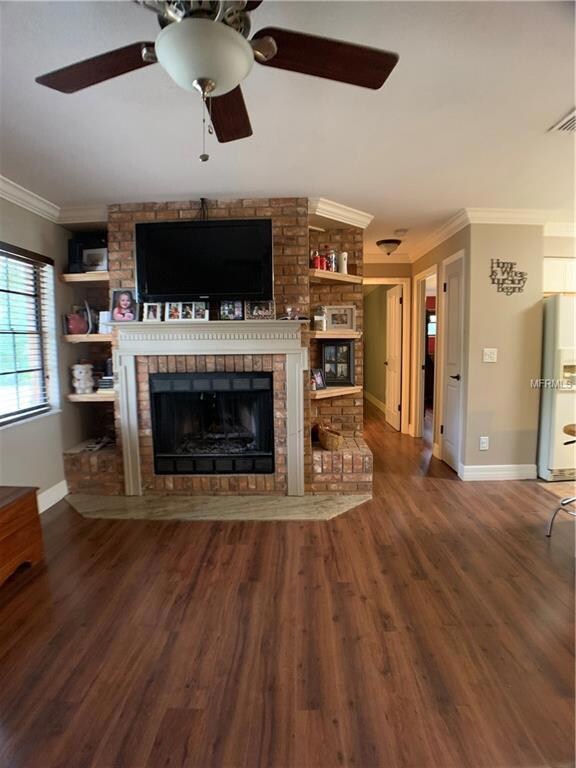 Wood burning fireplace in living room.