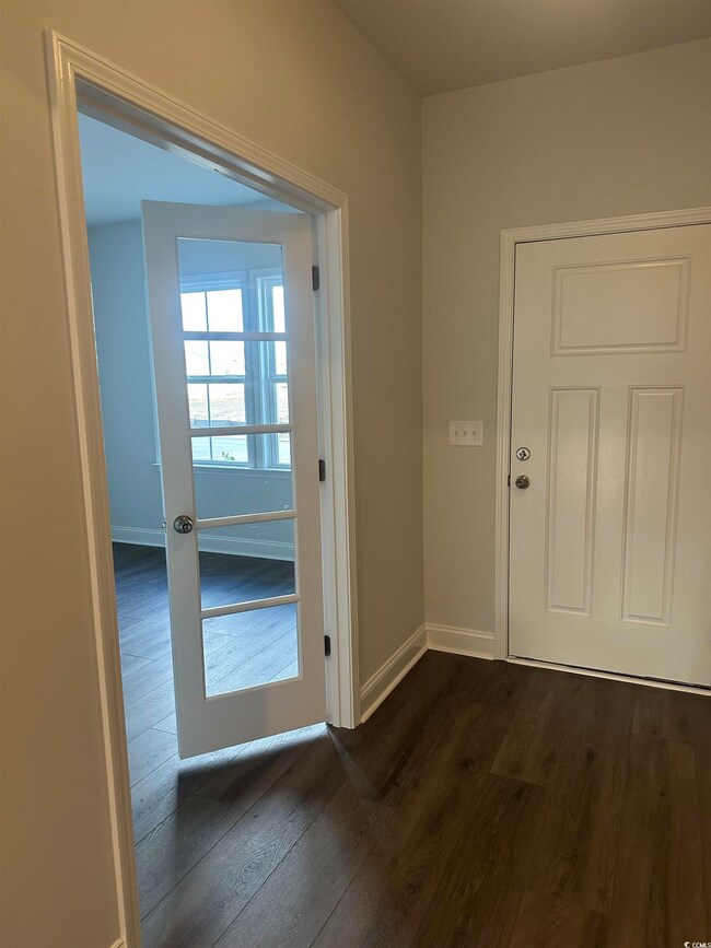Entryway featuring dark hardwood / wood-style floo
