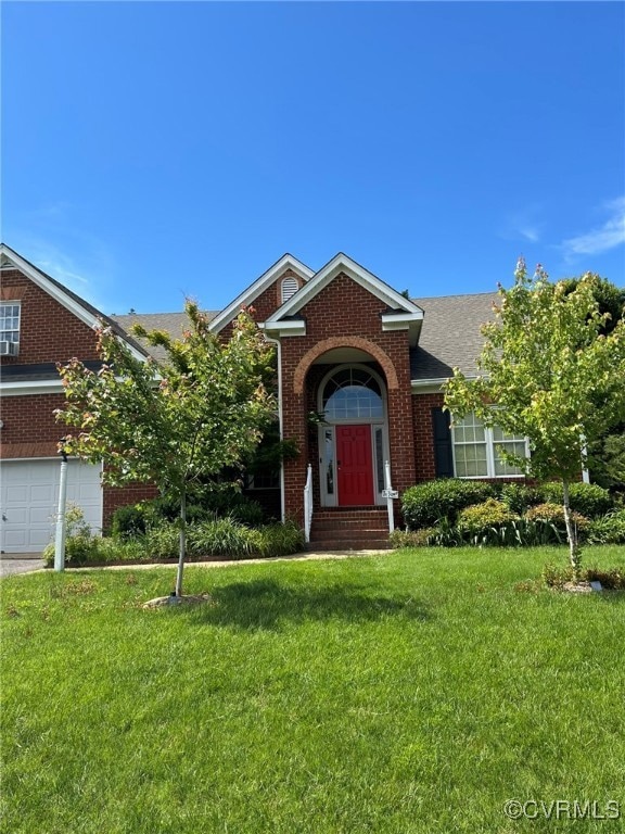 View of front of house with brick siding, a front