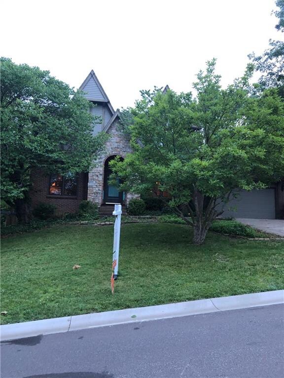 Gorgeous stone and brick faced 2 story home with a