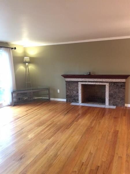 View of living room with very attractive fireplace
