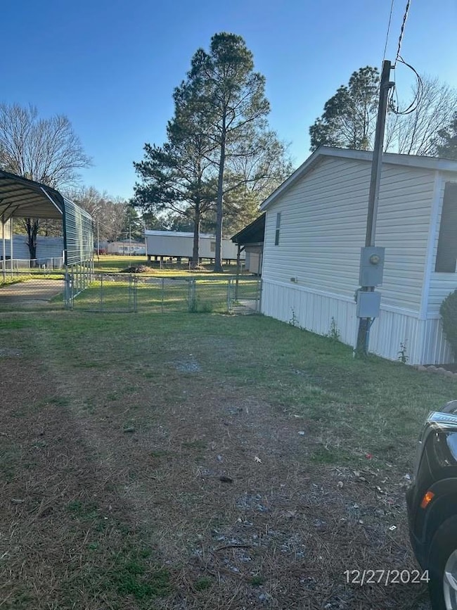 View of yard featuring a carport