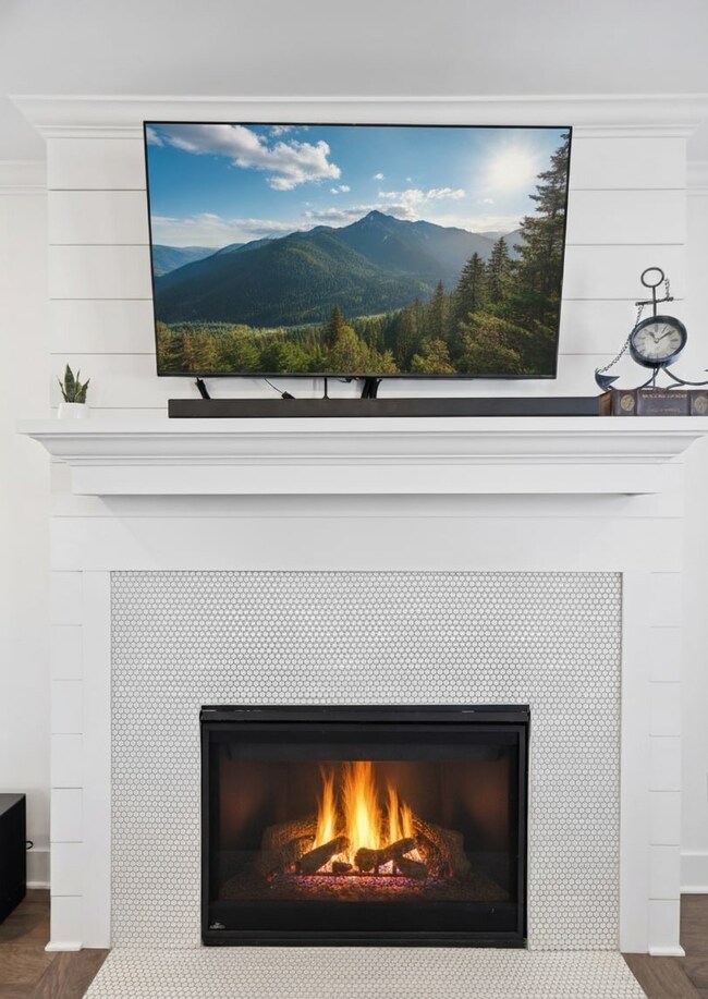 Modern fireplace with stunning penny tile detail.