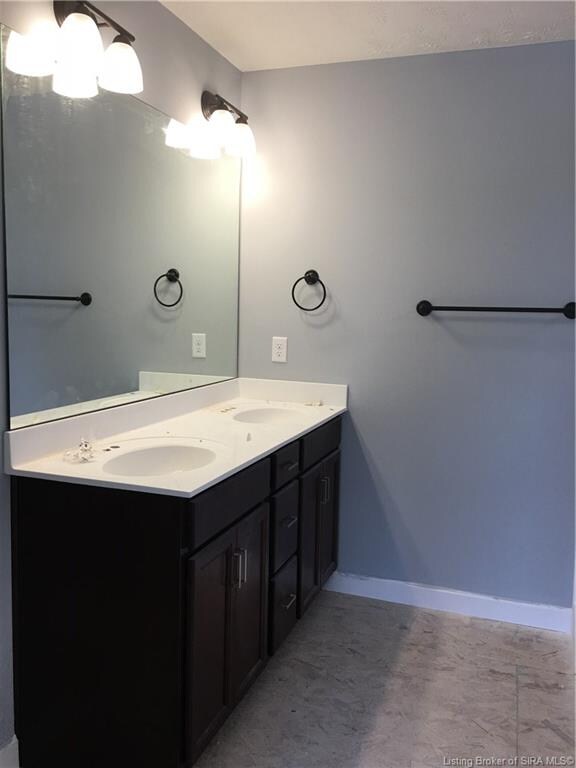 The Master bathroom has a double bowl vanity and s