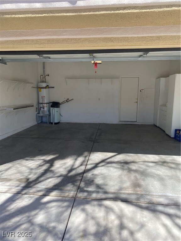 Garage with water heater and a garage door opener