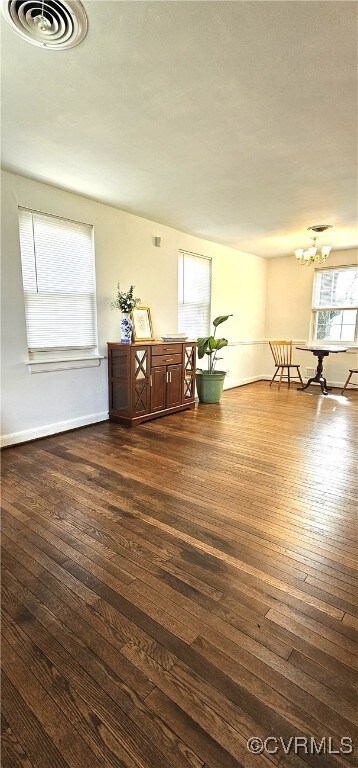 Unfurnished room featuring dark wood-type flooring