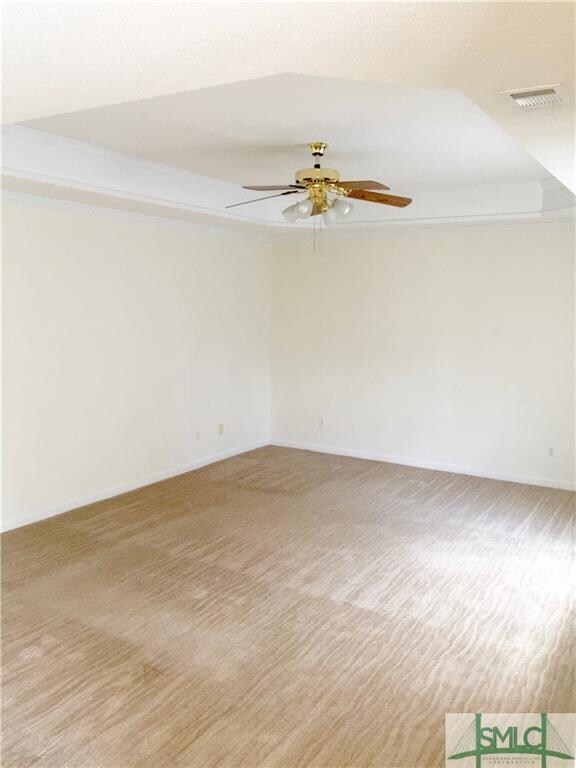 Large living room with Trey ceiling. Lots of light