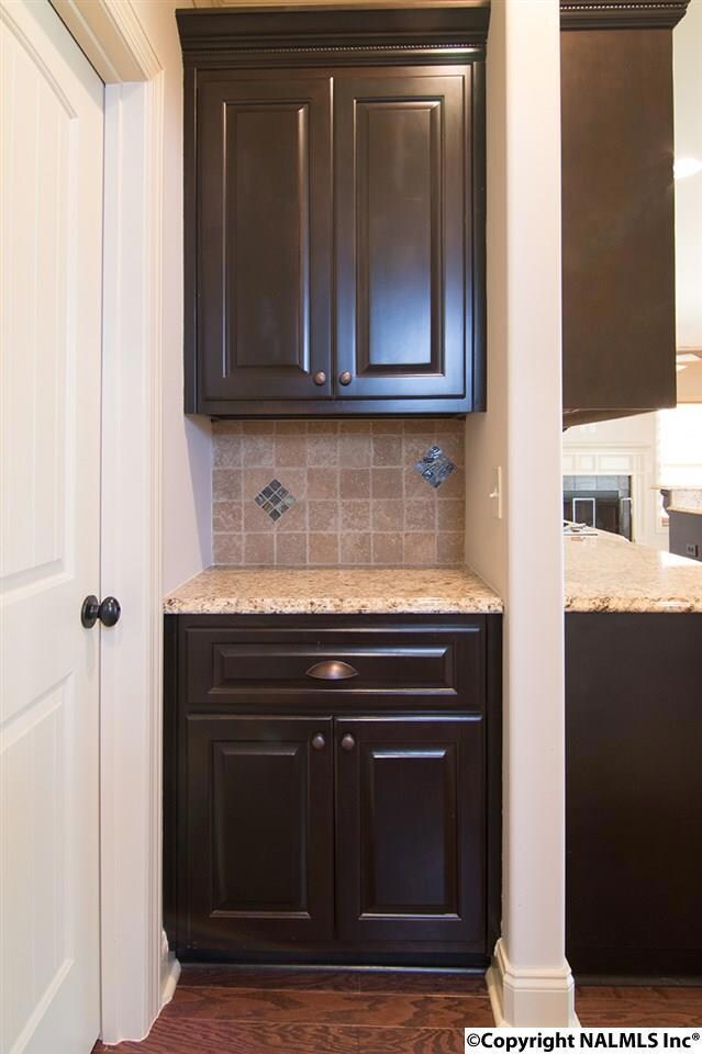 Located adjacent to kitchen, great room, and dining room, this built-in service piece makes a great coffee bar or snack station.