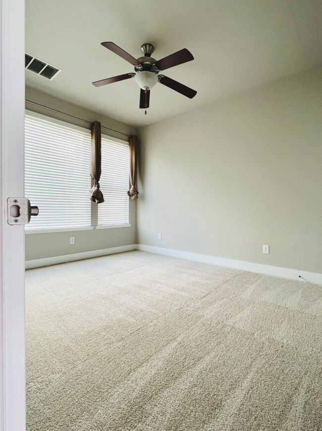 bedroom with all new soft carpet and paint.