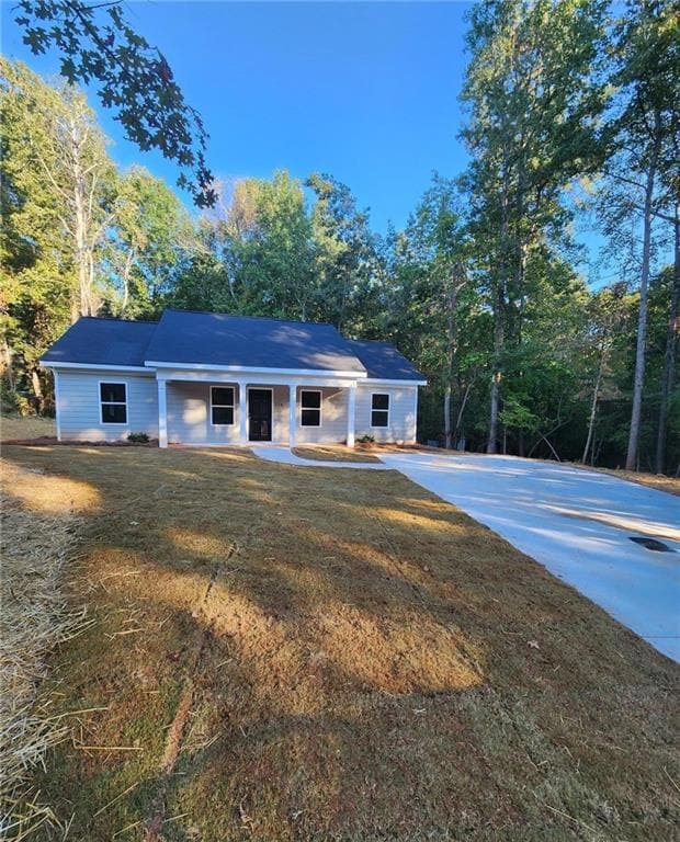 View of front of house featuring a front lawn