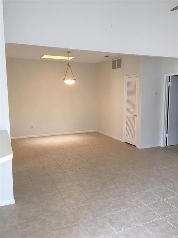 Empty room featuring baseboards