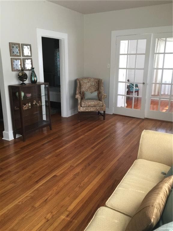 Sitting room featuring wood finished floors