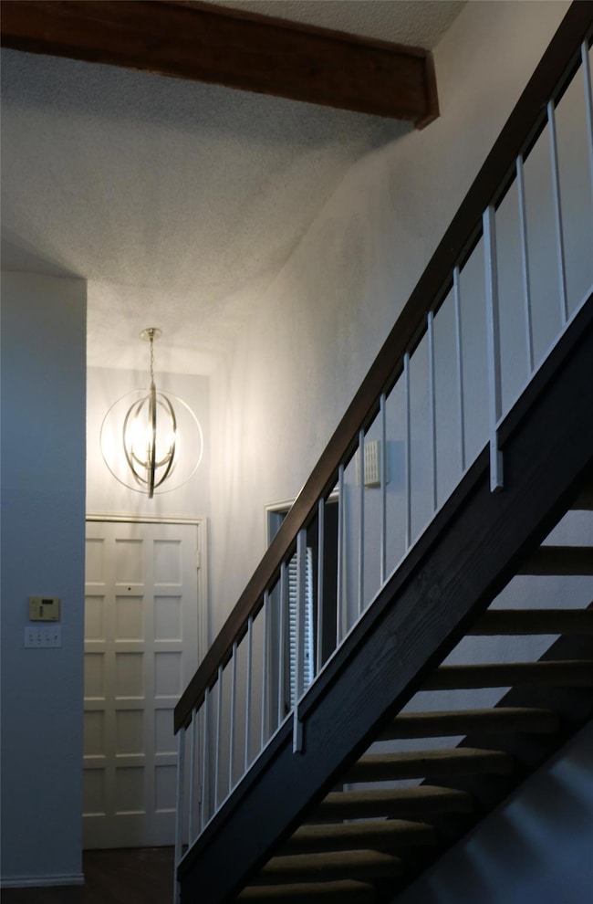 Stairs with hardwood / wood-style flooring, a text