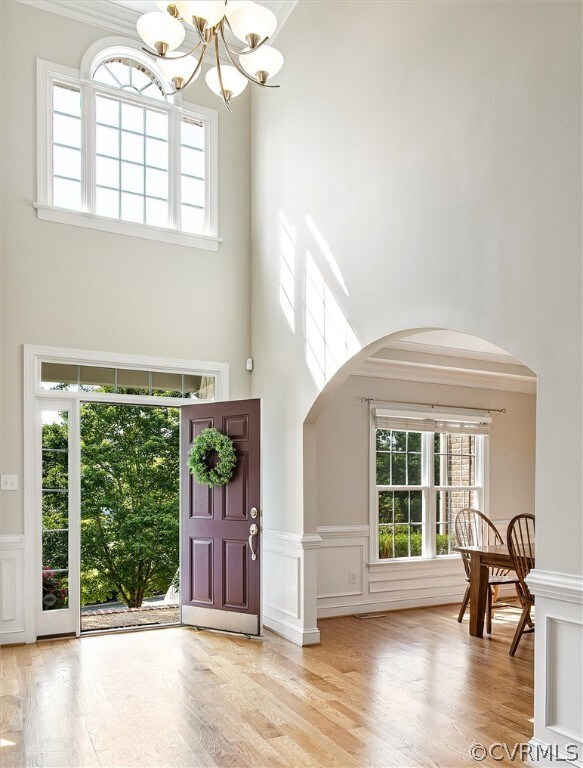 The front door opens to a well lit two-story foyer