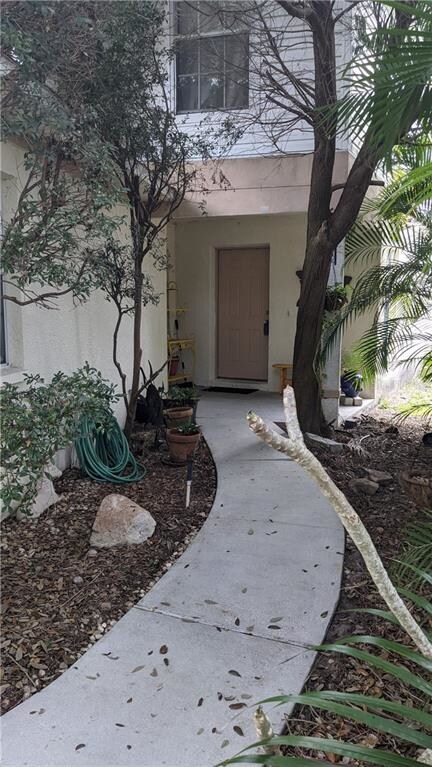Walkway to front door on right side of garage.
