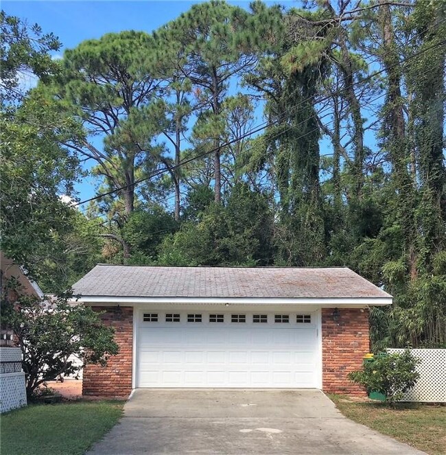 Two car garage with electric opener.  Seller cuts grass and maintains lawn in exchange for using garage for storage of lawn equipment, etc. - she will build her own garage in 2019.