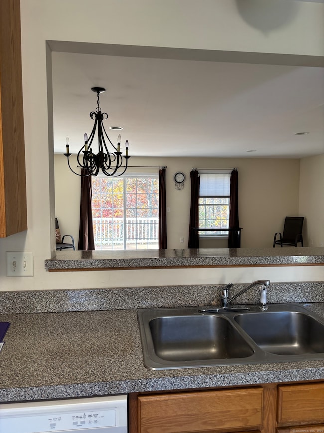 Kitchen view into dining and living area