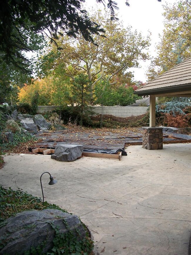 Pool area with Rock waterfall. Pool has been cover