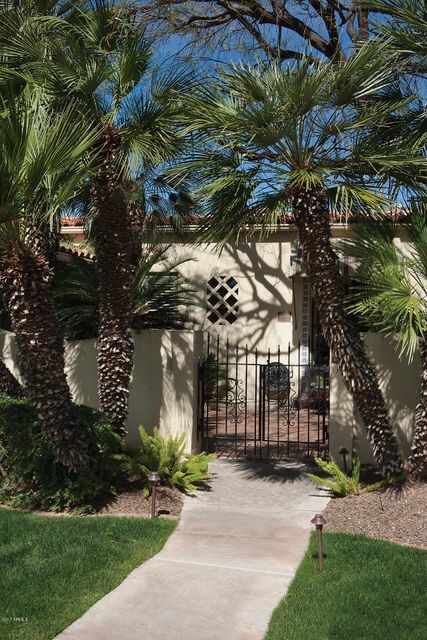 Gated lush entry courtyard