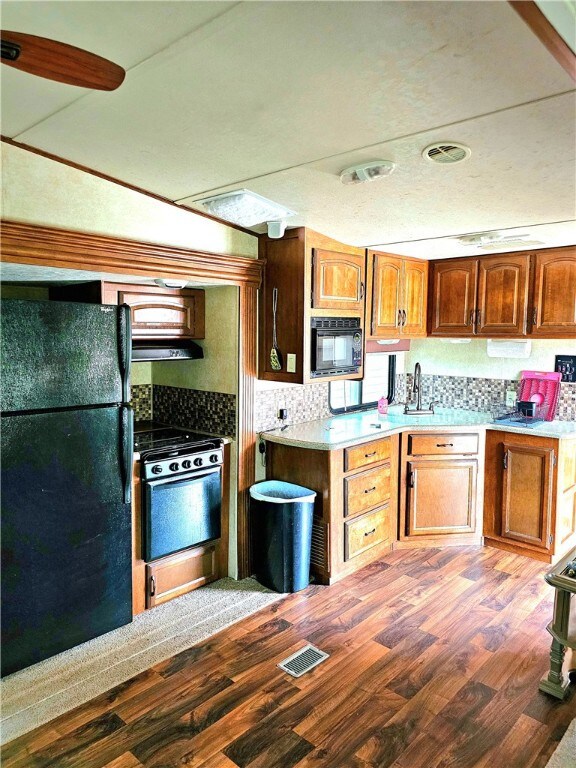 Kitchen with full size refrigerator
