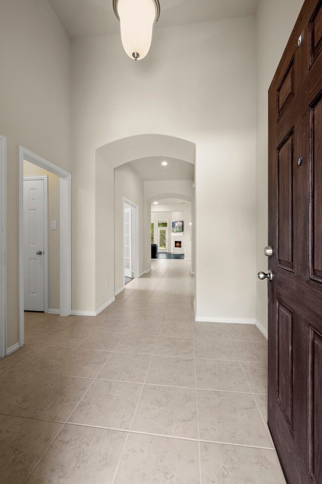 Entry with views of the hallway leading into the kitchen and family room.