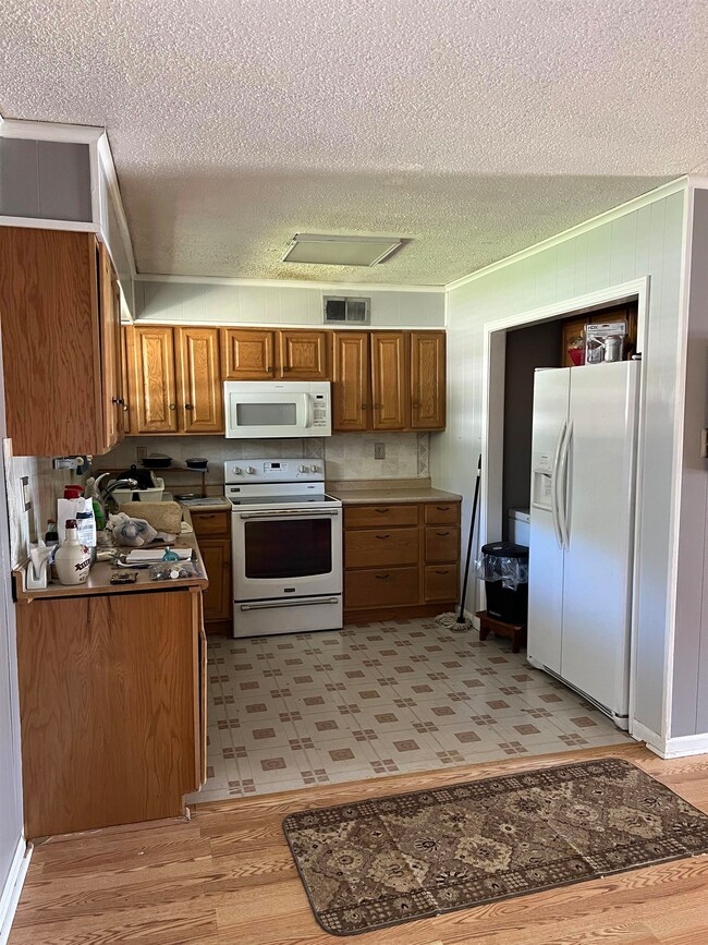 Kitchen with light hardwood / wood-style flooring,