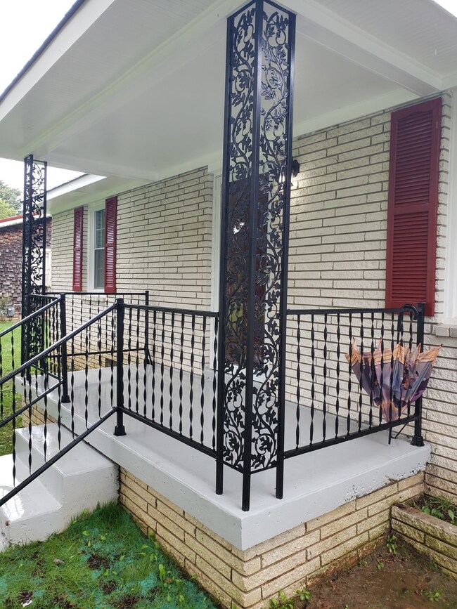 Stepping onto a beautiful covered front porch on shady street in Portland Tenn.  Home recently remodeled with new updated roof
