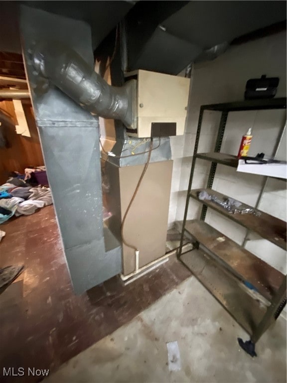 Utility room featuring heating unit