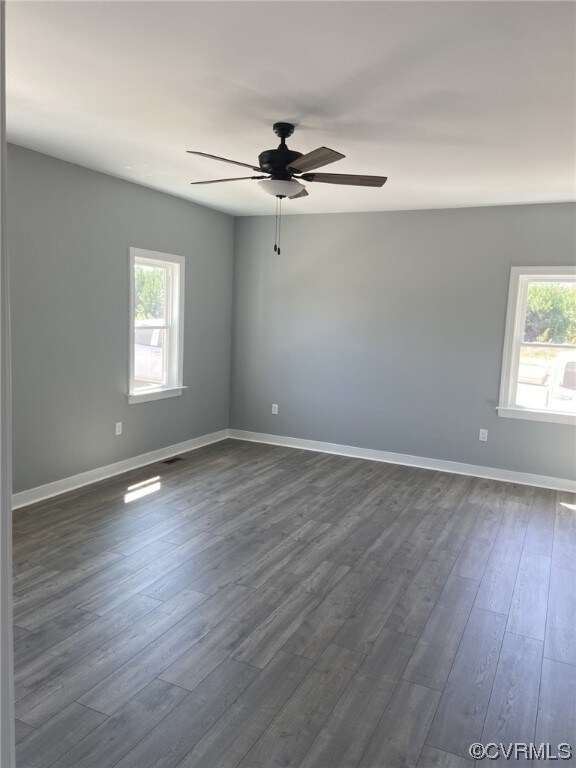 Primary bedroom  with light laminate flooring and