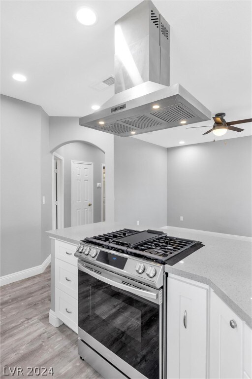 Stainless range hood with lights; stove has air fr
