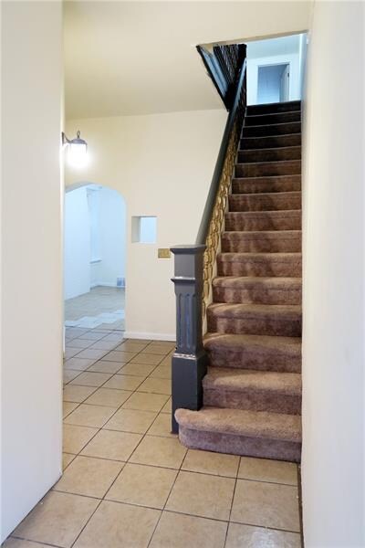 Foyer:  5x16.  Ceramic tile throughout first floor