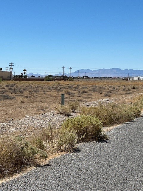 View of mountain backdrop featuring rural landscap