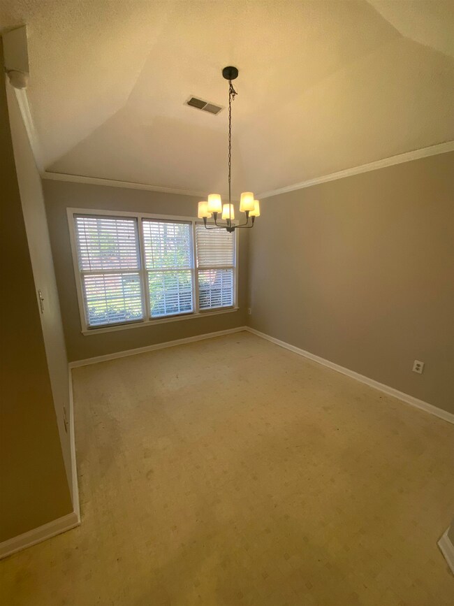 Unfurnished Formal Dining room with a chandelier, 