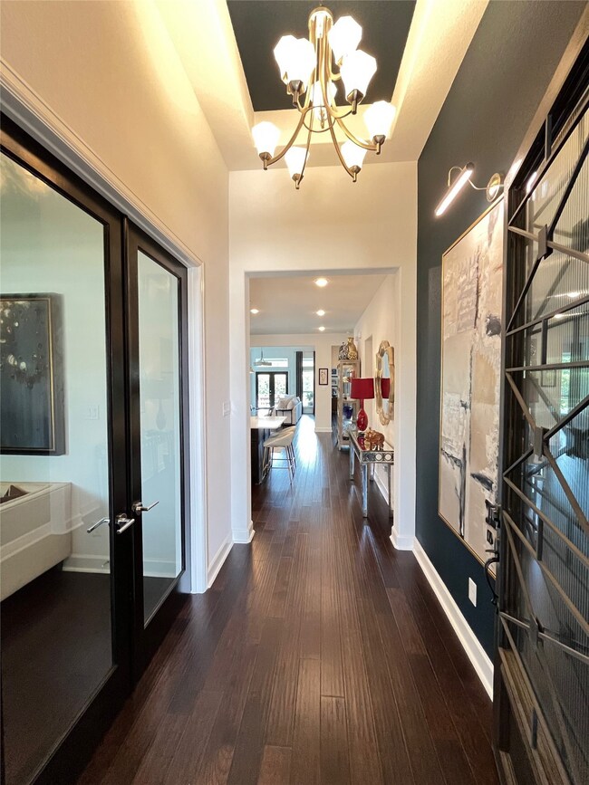 Front entry foyer with glass French doors that lea