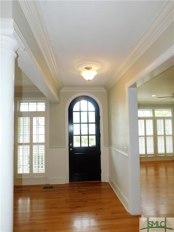 Warm and welcoming. Unique arched doorway, crown m