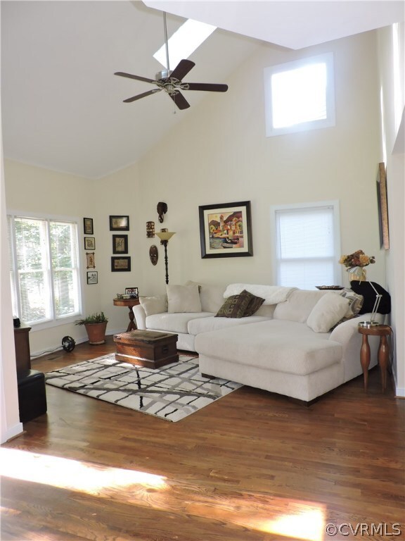 Family room has skylight, lots of windows and a be