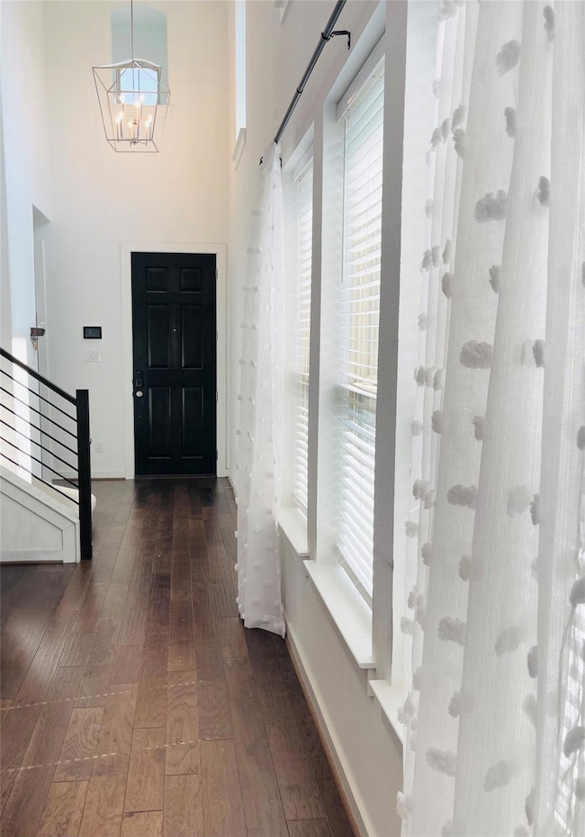 Entrance foyer with hardwood / wood-style floorin