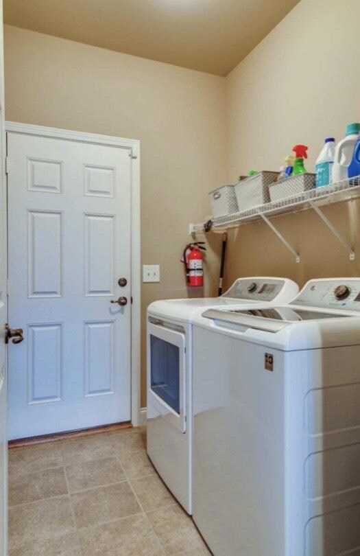 Laundry Room/Mudroom Leads to Garage. Washer and Dryer Convey! 