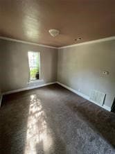 Spare room featuring baseboards and ornamental molding