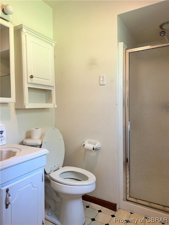 Bathroom featuring vanity, a shower with shower do